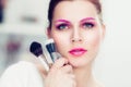 The makeup artist holds powder brushes Royalty Free Stock Photo