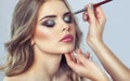 Makeup artist makes smoky eyes makeup. Applying make-up