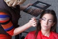 Makeup artist preparing eyeshadow