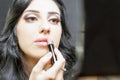 Makeup artist woman doing make-up using cosmetic brush for yourself Royalty Free Stock Photo