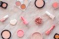 Makeup background with rounge, powder and tools on light brown table top view Royalty Free Stock Photo