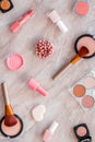 Makeup background with rounge, powder and tools on light brown table top view Royalty Free Stock Photo