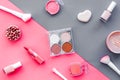Makeup background with rounge, powder and tools on pink and grey table top view Royalty Free Stock Photo