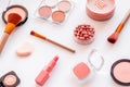 Makeup background with rounge, powder and tools on white table Royalty Free Stock Photo
