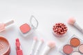 Makeup background with rounge, powder and tools on white table copy space Royalty Free Stock Photo