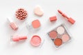 Makeup background with rounge, powder and tools on white table top view Royalty Free Stock Photo