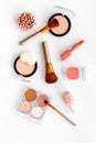 Makeup background with rounge, powder and tools on white table top view Royalty Free Stock Photo