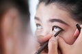 Makeup beauty with brush eye liner Royalty Free Stock Photo