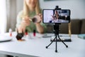 Makeup blogger influencer recording tutorial video with phone for social media Royalty Free Stock Photo