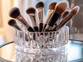 Makeup brush collection displayed in clear crystal holder beauty tools cosmetics elegance brushes Royalty Free Stock Photo