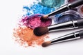 Makeup brush and colorful cosmetic powder on white background. Ai generative Royalty Free Stock Photo