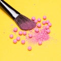 Makeup brush with crushed and whole shimmer blush balls Royalty Free Stock Photo