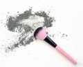 Makeup brush with gray color eyeshadow powder. Royalty Free Stock Photo