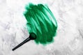 Makeup brush with green shiny glitter. Royalty Free Stock Photo