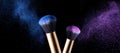 Makeup brush with pink and blue powder explosion Royalty Free Stock Photo