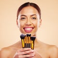 Makeup, brush and portrait of woman with cosmetic beauty product for skincare isolated in a studio brown background