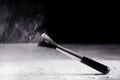 Makeup brush with powder dust splashing and explosion in air on black Royalty Free Stock Photo