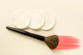 Makeup brush with powder stroke and sponges on white background. Instruments of fashion beautician or home cosmetics applying