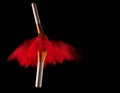 Makeup brush with red powder explosion on black background Royalty Free Stock Photo