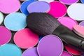 Makeup brush and set of colorful eye shadows close-up. Bright colorful background Royalty Free Stock Photo