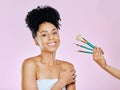 Makeup brush, smile and studio portrait of woman with tools choice for skincare glow, routine treatment or wellness self Royalty Free Stock Photo