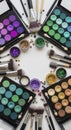 Makeup brushes and colorful eye shadow palettes Royalty Free Stock Photo