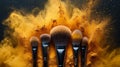 Professional Makeup Brushes with Exploding Golden Powder Royalty Free Stock Photo