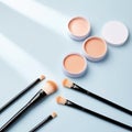 Makeup Brushes and Face Powders on Light Blue Background Royalty Free Stock Photo