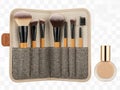 Makeup brushes and foundation bottle displayed on a textured pouch Royalty Free Stock Photo