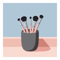 Makeup brushes in grey holder with pink handles on blue background vector illustration Royalty Free Stock Photo