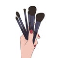 Makeup brushes in hand on white background Royalty Free Stock Photo