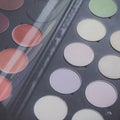 Makeup brushes and make-up eye shadows on desk Royalty Free Stock Photo