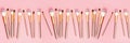 Makeup brushes on pink background. Flat lay, top view, overhead. Horizontal long banner for web design Royalty Free Stock Photo