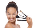 Makeup, brushes and portrait of happy woman in studio for beauty, foundation and cosmetics. Face of young model, artist