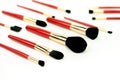 Makeup brushes set in red color on white background. Professional makeup tools Royalty Free Stock Photo