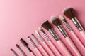 Makeup brushes with solid colors backgrounds Royalty Free Stock Photo