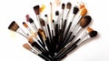 makeup brushes on white background with makeup