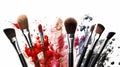 makeup brushes on white background with makeup