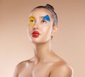 Makeup, clown and young woman with facial art, natural beauty and wellness with brown studio background. Artist, female Royalty Free Stock Photo