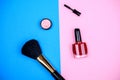 Makeup collection with lipstick, mascara, nail polish and brush