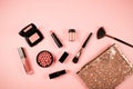 Makeup cosmetic flay lay pink cloral background