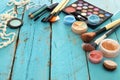 makeup cosmetics beauty tools and brushes on wooden background