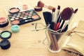 makeup cosmetics beauty tools and brushes on wooden background Royalty Free Stock Photo