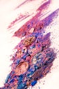 Makeup cosmetics. Eyeshadow crushed palette, colorful eye shadow powder on white background.