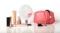 Makeup cosmetics, pink cosmetic bag and a mirror