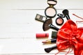 Makeup cosmetics in red bag on white background. Santa Claus gifts in a bag. Concept holidays. Royalty Free Stock Photo