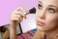 Makeup and cosmetics - woman using blush brush Royalty Free Stock Photo