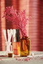 Makeup desk with shiny lip gloss, cosmetic jars in the makeup store