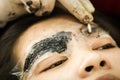 Makeup eyebrow tattooing, pretty asian woman face Royalty Free Stock Photo