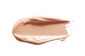 Makeup foundation, concealer swatch smudge smear isolated on white background. Nude make up base brushstroke, swipe